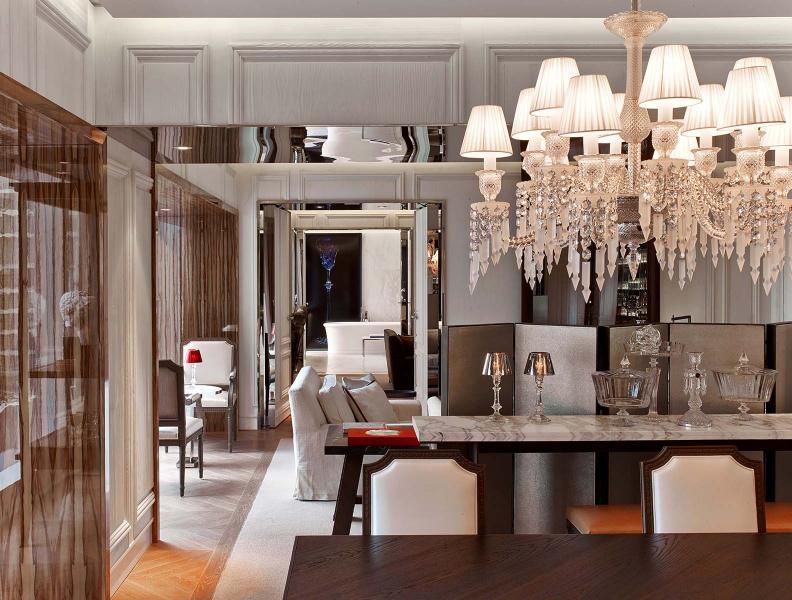 baccarat suite living area with chandelier