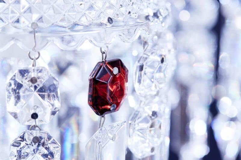 Chandelier with one 2024 red crystal